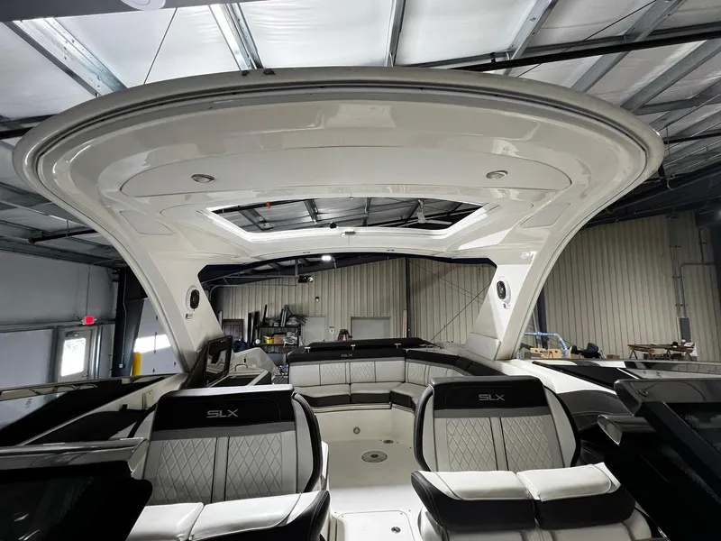 Slide: The Image of 2016 Sea Ray 310 SLX boat interior with luxurious seating and sleek design. - 20