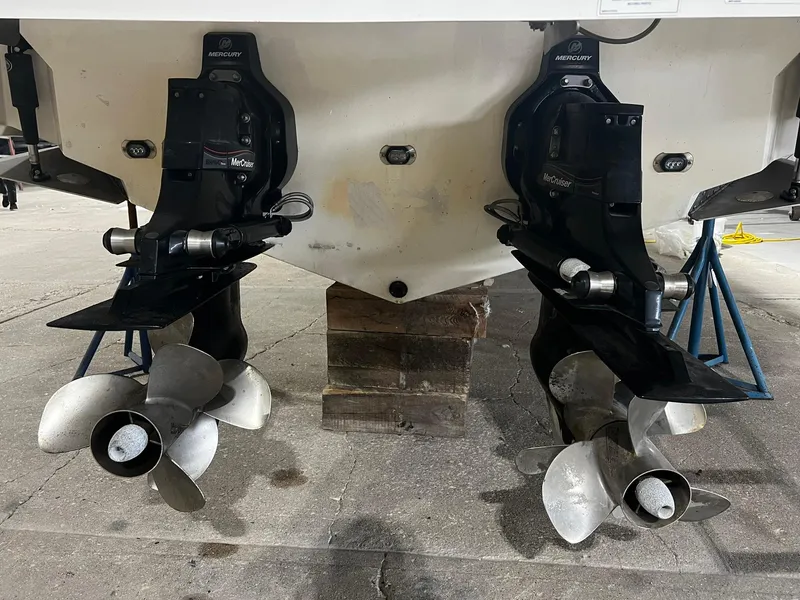 Slide: The Image of Rear view of 2016 Sea Ray 310 SLX boat with dual Mercury outdrives. - 5