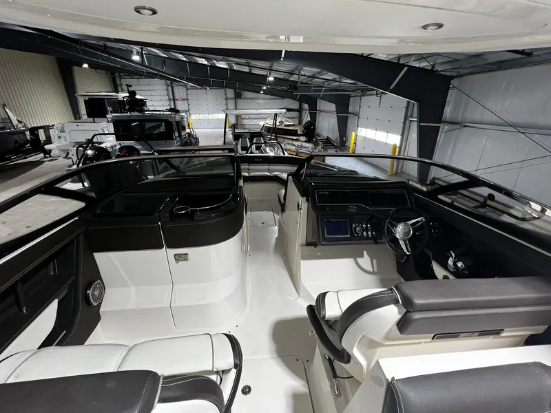 Slide: The Image of 2016 Sea Ray 310 SLX boat interior in a storage facility. - 9