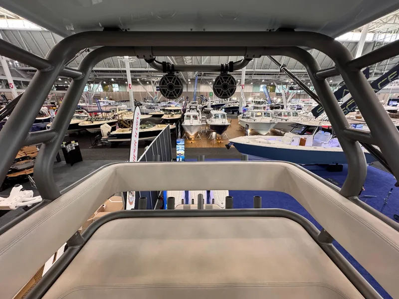 Slide: The Image of 2025 Solace 37 CS boat interior at a boat show, showcasing seating and speakers. - 10