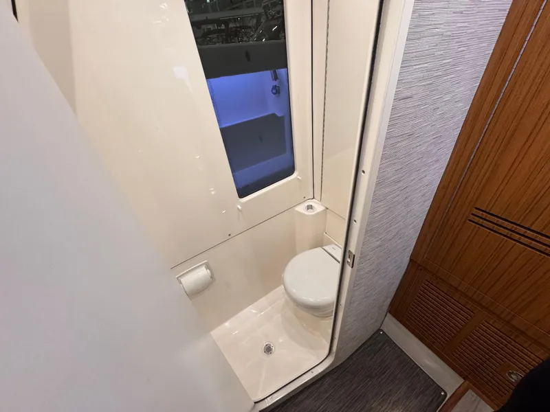Slide: The Image of Compact bathroom in 2025 Solace 37 CS boat, featuring modern design and amenities. - 11
