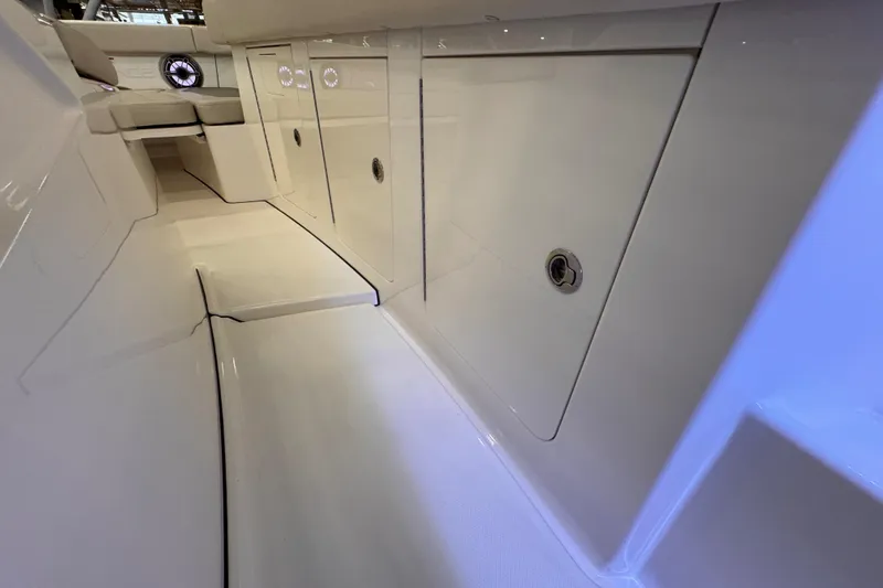 Slide: The Image of Interior view of 2025 Solace 37 CS boat, showcasing sleek design and storage compartments. - 21