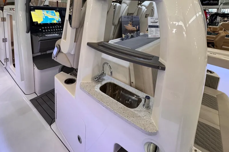 Slide: The Image of 2025 Solace 37 CS boat interior with sink and navigation display. - 22