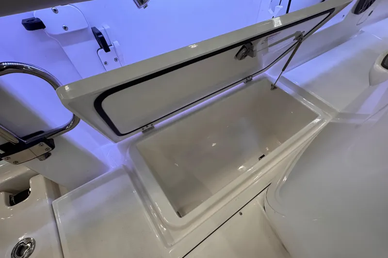Slide: The Image of Open storage compartment on 2025 Solace 37 CS boat, featuring sleek design and ample space. - 23