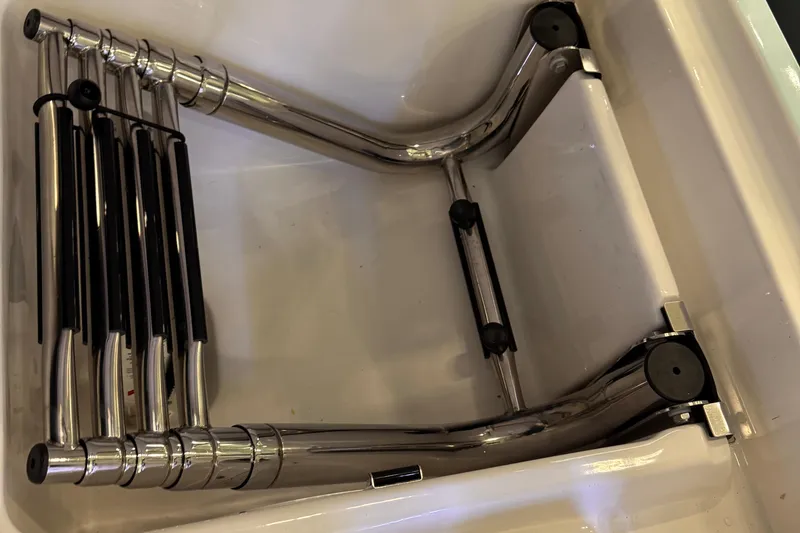 Slide: The Image of Foldable stainless steel ladder in Solace 37 CS boat, 2025 model. - 24