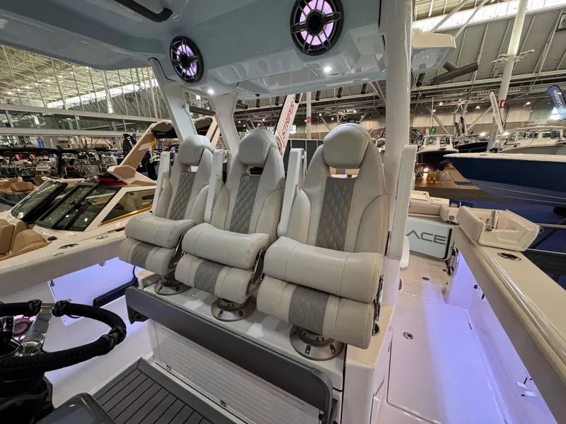 Slide: The Image of Luxury seating on 2025 Solace 37 CS boat at indoor exhibition. - 7