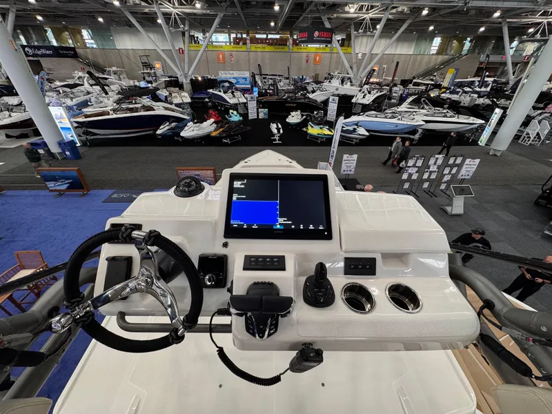 Slide: The Image of Helm of 2025 Solace 37 CS boat at indoor boat show. - 9