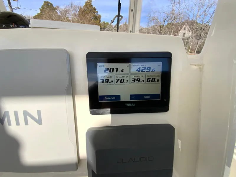 Slide: The Image of Yamaha display on 2024 Cobia 240 Center Console boat dashboard. - 16