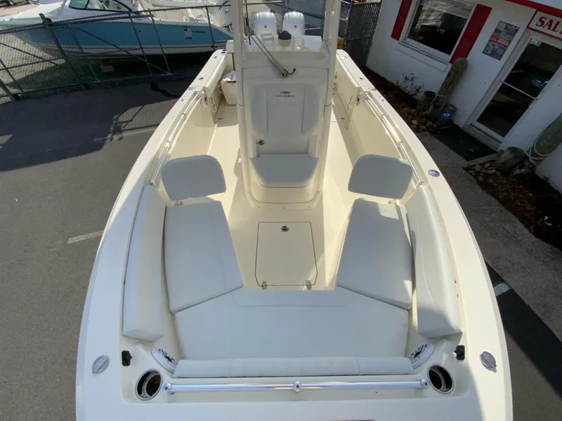 Slide: The Image of 2024 Cobia 240 Center Console boat with spacious seating and sleek design. - 21