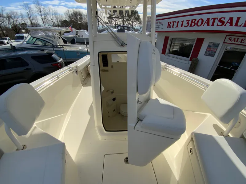 Slide: The Image of 2024 Cobia 240 Center Console boat interior with seating and storage. - 26