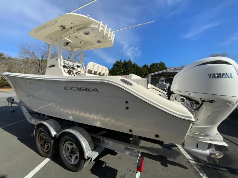 Slide: The Image of 2024 Cobia 240 Center Console boat on trailer with Yamaha engine. - 7
