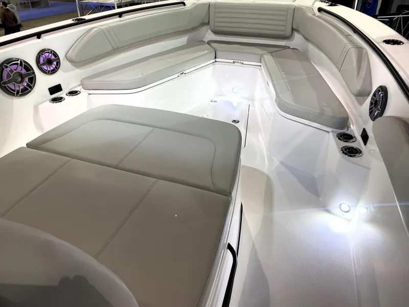 Slide: The Image of 2025 Edgewater 340CC boat interior with spacious seating and modern design. - 21