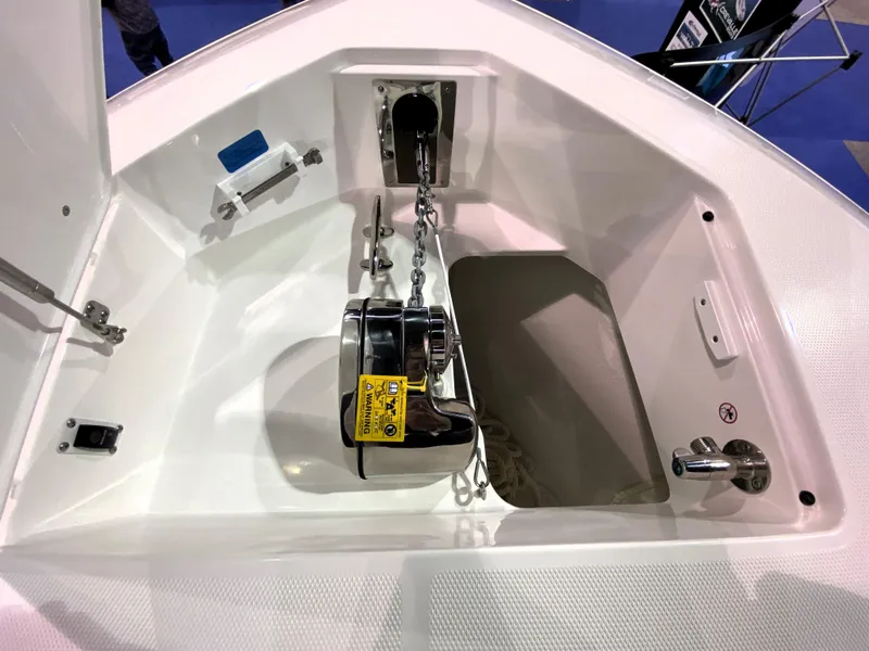 Slide: The Image of 2025 Edgewater 340CC anchor compartment with chain and storage. - 25