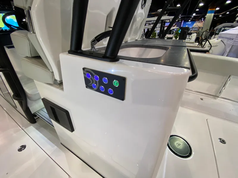 Slide: The Image of 2025 Edgewater 340CC boat interior with control panel and seating. - 27
