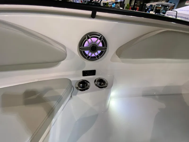 Slide: The Image of 2025 Edgewater 340CC boat interior with speaker and cup holders. - 29