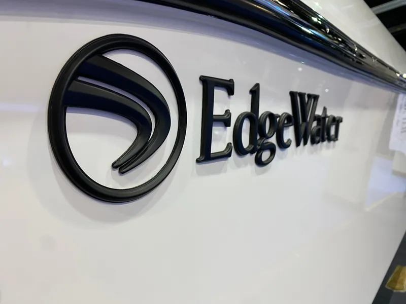 Slide: The Image of Edgewater 340CC 2025 logo on boat hull, close-up view. - 31