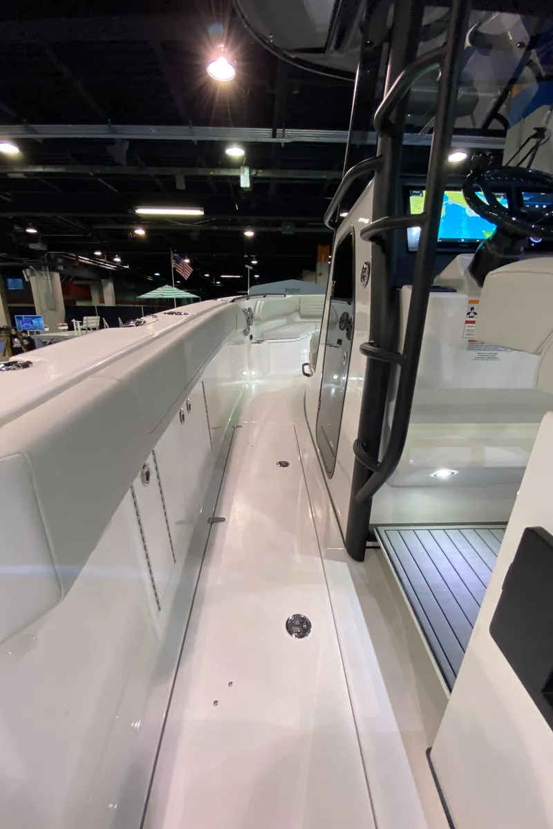 Slide: The Image of 2025 Edgewater 340CC boat interior at a showroom, showcasing sleek design and modern features. - 39