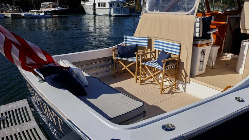 Slide: The Image of Fortier 33 boat deck with chairs, 2008 model, docked in a marina. - 12