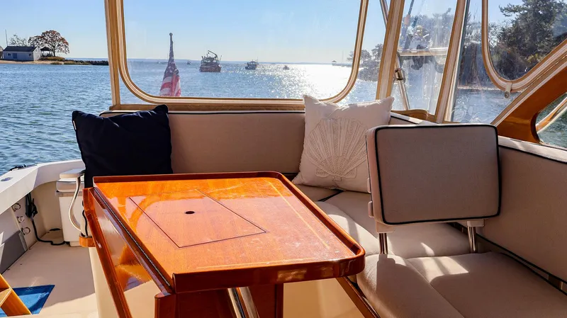 Slide: The Image of Cozy seating area on a 2008 Fortier 33 boat with ocean view. - 17