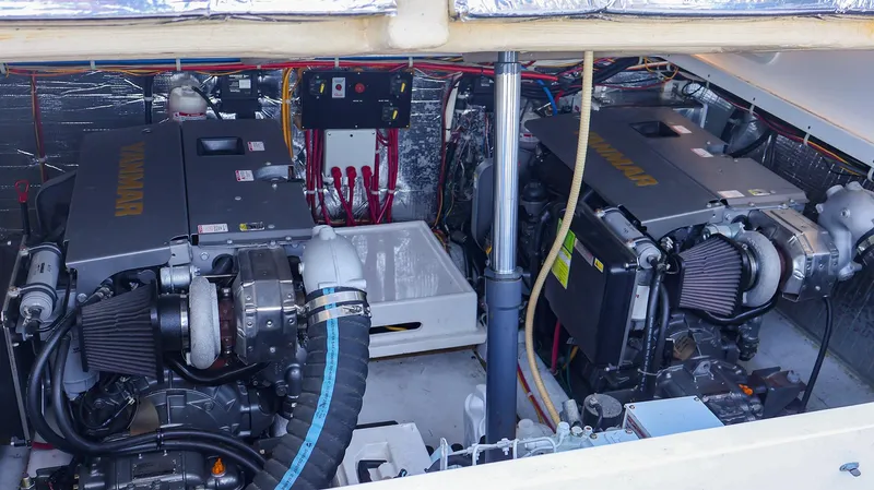 Slide: The Image of Engine room of 2008 Fortier 33 boat with dual engines and wiring. - 33