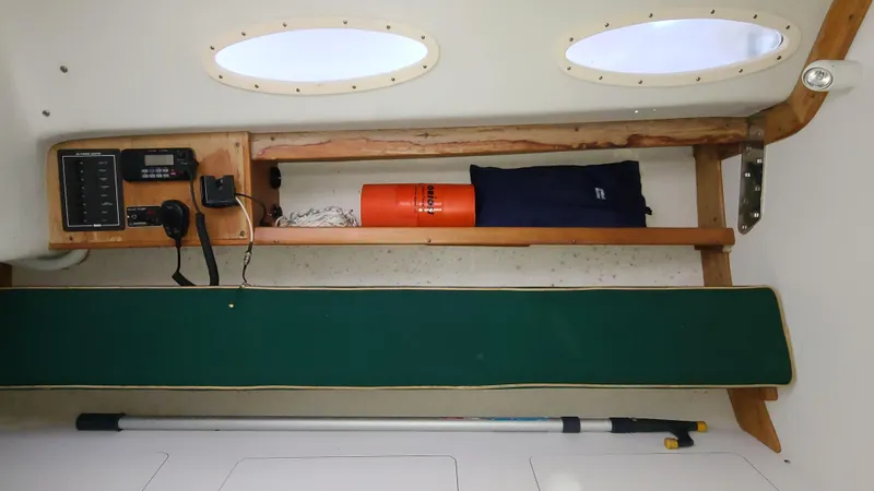 Slide: The Image of Interior of 2007 Alerion Express 28 sailboat with storage shelves and equipment. - 12