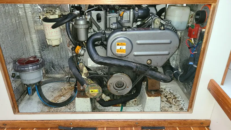 Slide: The Image of Engine compartment of a 2007 Alerion Express 28 sailboat, showcasing mechanical components. - 17