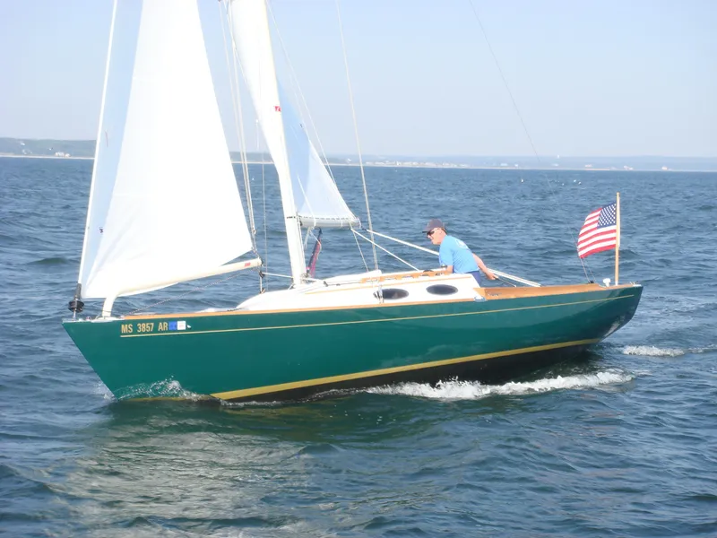 Slide: The Image of Sailing on a 2007 Alerion Express 28 with American flag on open water. - 4