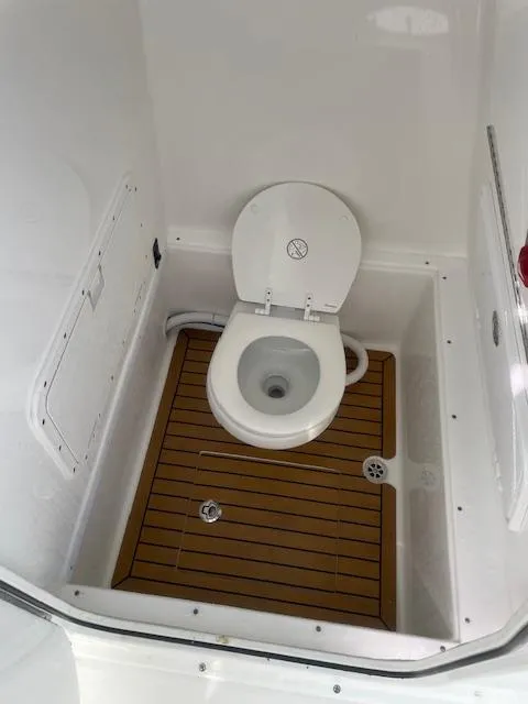Slide: The Image of 2019 Buddy Davis CC boat toilet with wooden floor panel. - 3