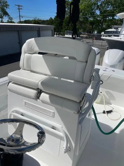 Slide: The Image of 2019 Buddy Davis CC boat with white cushioned seating and steering wheel. - 4