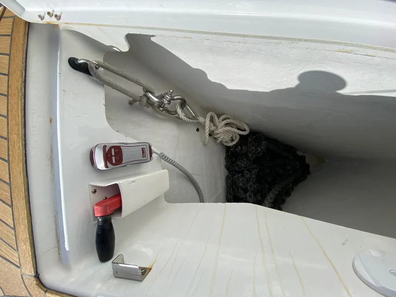 Slide: The Image of Anchor locker of 2013 Jeanneau 57 sailboat with rope and winch handle. - 25