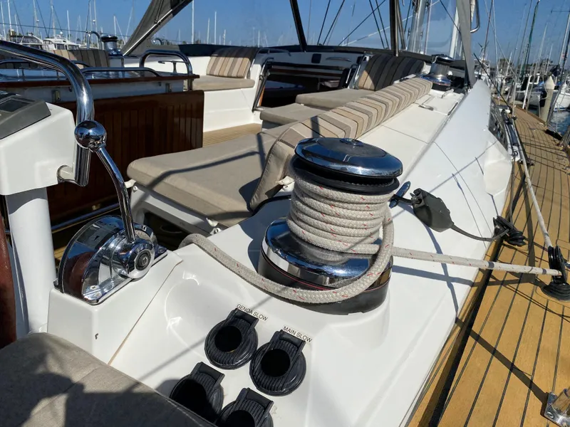 Slide: The Image of 2013 Jeanneau 57 yacht deck with winch and seating area. - 43