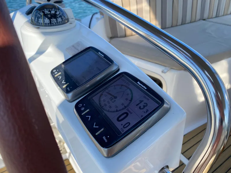 Slide: The Image of Navigation instruments on 2013 Jeanneau 57 yacht, featuring compass and digital displays. - 44