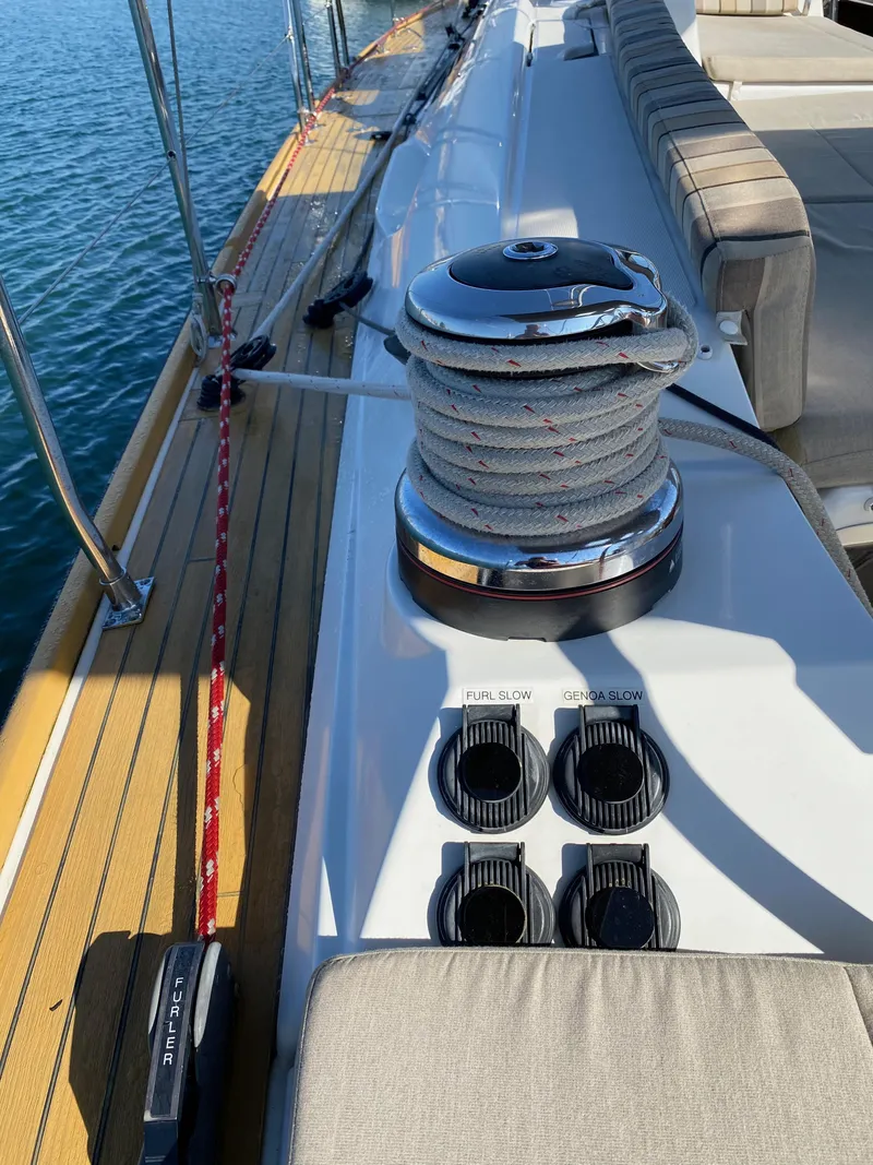 Slide: The Image of Deck view of 2013 Jeanneau 57 sailboat with winch and rope details. - 45