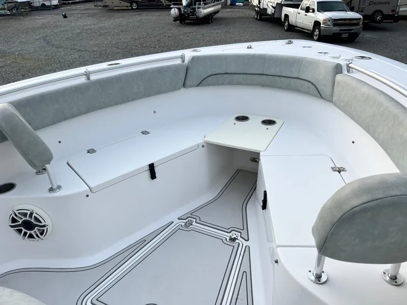 Slide: The Image of 2019 Sportsman Open 252 Center Console boat interior with cushioned seating and storage. - 11