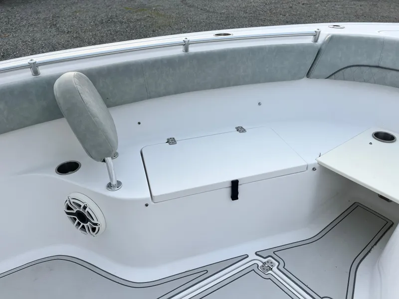 Slide: The Image of 2019 Sportsman Open 252 Center Console boat interior with seating and storage. - 12