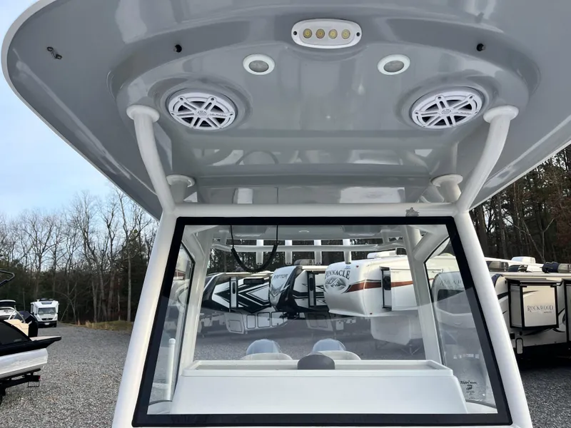 Slide: The Image of 2019 Sportsman Open 252 Center Console boat with speakers and LED lights. - 16