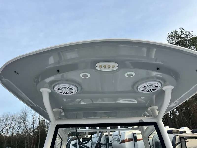 Slide: The Image of 2019 Sportsman Open 252 Center Console boat roof with speakers and lights. - 17
