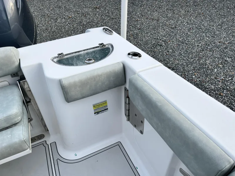 Slide: The Image of 2019 Sportsman Open 252 Center Console boat interior with seating and storage. - 29