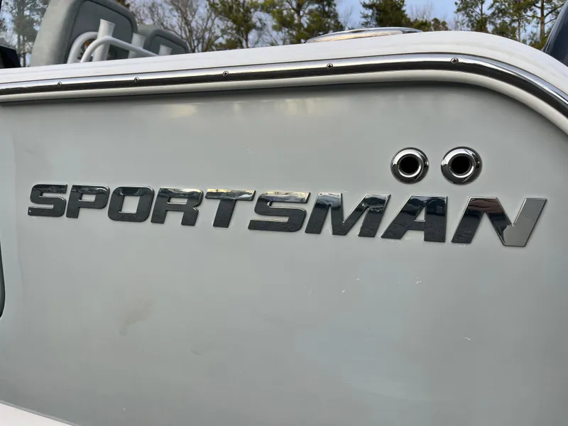 Slide: The Image of 2019 Sportsman Open 252 Center Console boat logo on side panel. - 8