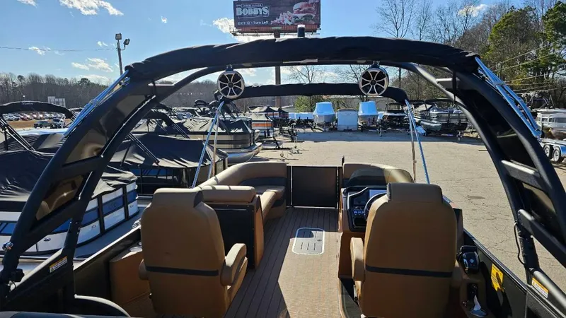 Slide: The Image of 2025 Bentley Pontoons Elite 253 Swingback interior with luxurious seating and modern design. - 7
