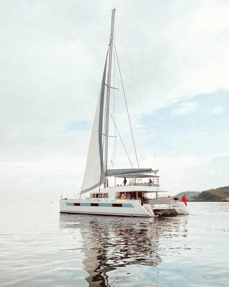 Slide: The Image of 2014 Lagoon 620 catamaran sailing on calm waters. - 125