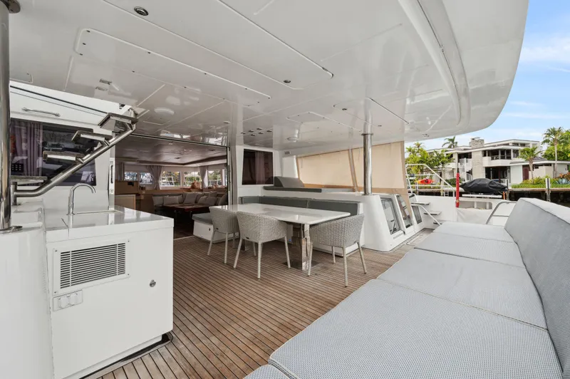 Slide: The Image of Spacious deck of 2014 Lagoon 620 yacht with seating and dining area. - 25