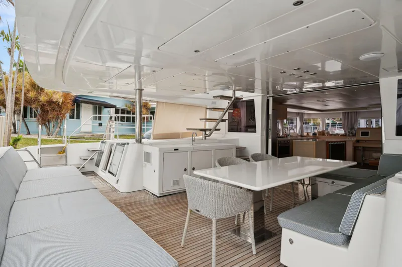 Slide: The Image of 2014 Lagoon 620 yacht interior with spacious seating and dining area. - 26