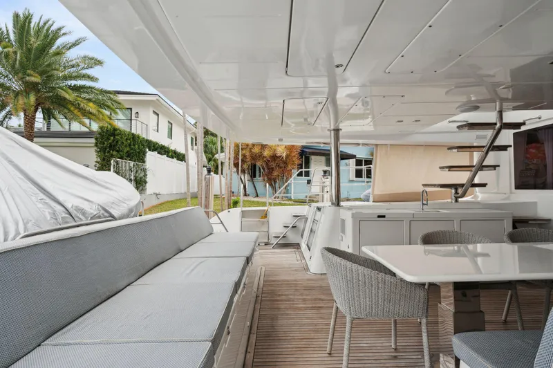 Slide: The Image of Spacious deck of 2014 Lagoon 620 yacht with seating and dining area. - 27