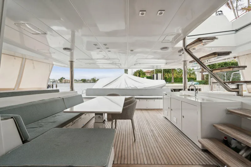 Slide: The Image of Spacious deck of 2014 Lagoon 620 yacht with seating and outdoor kitchen. - 33