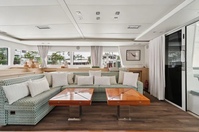 Slide: The Image of Luxurious interior of 2014 Lagoon 620 yacht with elegant seating and wooden tables. - 37