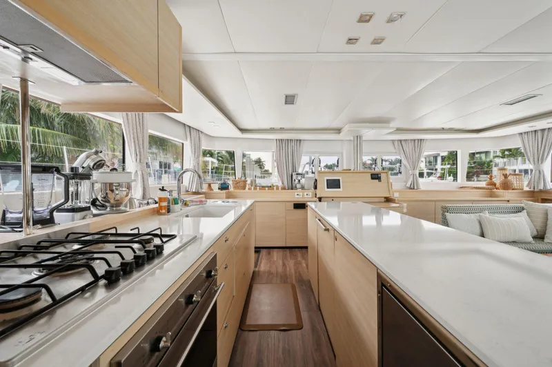 Slide: The Image of Spacious kitchen interior of 2014 Lagoon 620 yacht with modern appliances and ample counter space. - 43