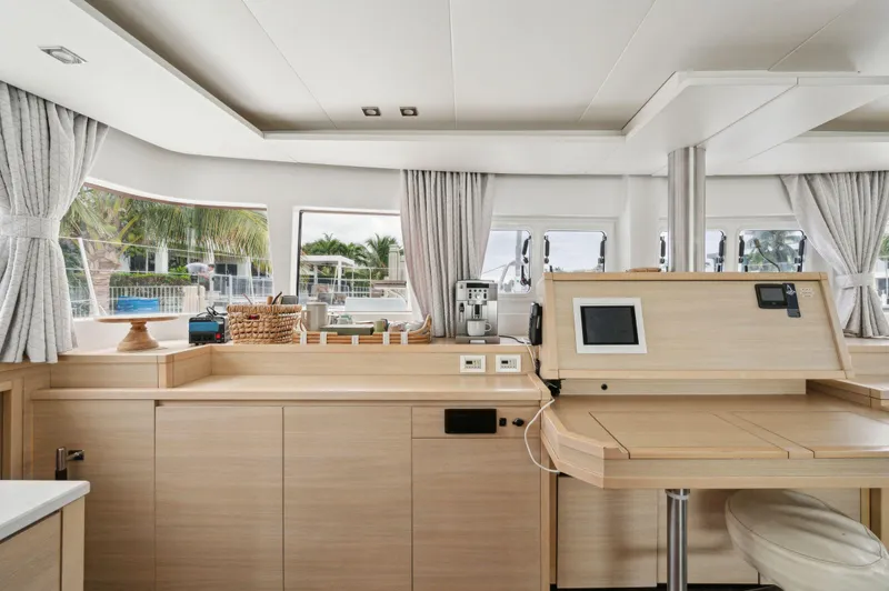 Slide: The Image of Luxurious interior of 2014 Lagoon 620 yacht with modern navigation station and panoramic windows. - 46