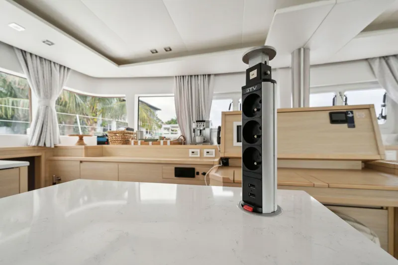 Slide: The Image of Luxurious interior of 2014 Lagoon 620 yacht with modern kitchen and pop-up power outlets. - 47