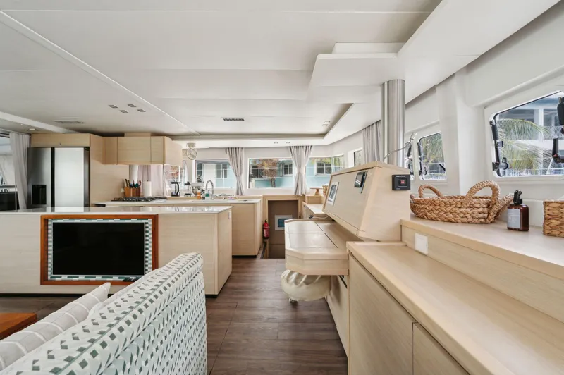 Slide: The Image of Luxurious interior of 2014 Lagoon 620 yacht with modern furnishings and ample natural light. - 49